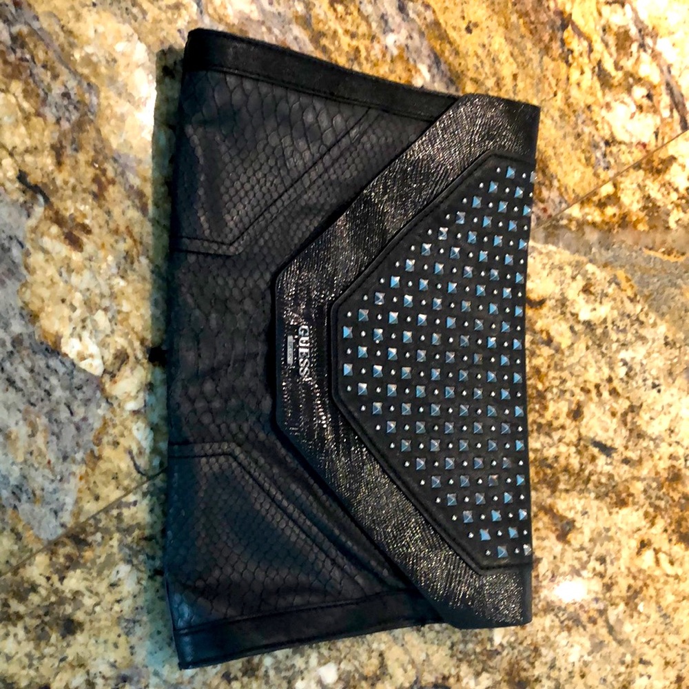 Envelope style purse. Faux leather.